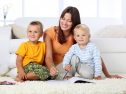 Mom and kids sitting on a clean floor