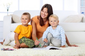 Mom and kids sitting on a clean floor