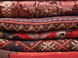 stack of Oriental area rugs